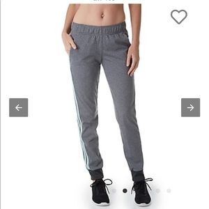 Adidas gray athletic sweatpants with blue stripes.